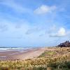 Bamburgh Beach and Castle  Limited Print of 5   Mount Sizes A4  16x12  20x16