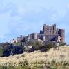Bamburgh above the Dunes  Limited Print of 5   Mount Sizes A4  16x12  20x16